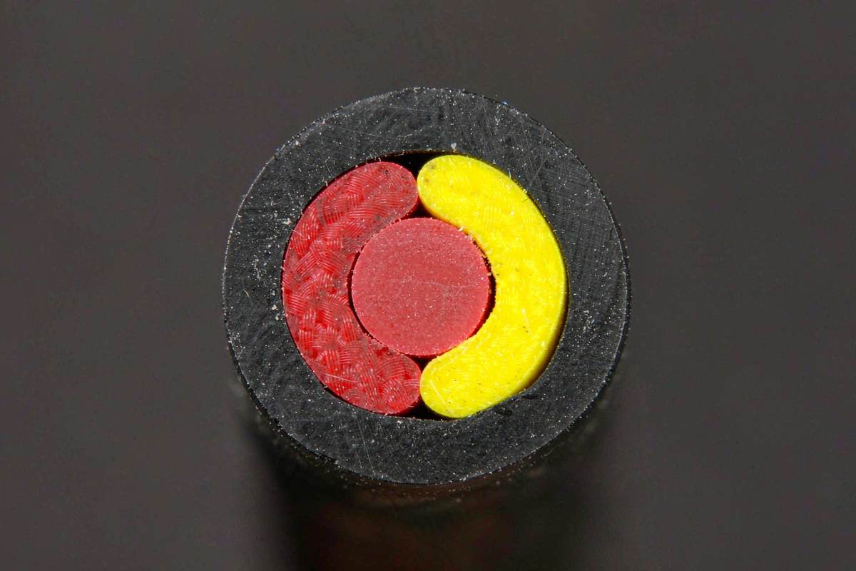 Cut end of Type K thermocouple extension cable, red and yellow insulated pair